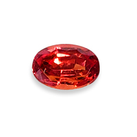 Oval unheated orange sapphire from the Umba River Valley in Africa.  This genuine untreated sapphire has deep reddish overtones.