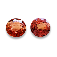 Pretty pair of lively round orange sapphires . This round pair of sapphires is very bright with flashes of red and fiery orange.