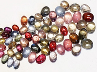 Multi color untreated sapphire cabochon ovals in assorted sizes.  These are natural untreated sapphires from the Umba River region of Tanzania and come in many colors and shades such as orange sapphire cabs, yellow sapphire cabs, green green sapphire cabo