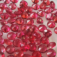 Natural round spinel color pink and poppy red sapphire melee  This round super bright and electric pomegranate color red sapphire melee has flashes of fushia and tangerine orange and is diamond cut in calibrated sizes 3.00mm and up. These reddish pin