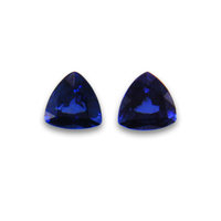 Pair of trillion blue sapphires with a deep blue tone. This pair of sapphires have no visible inclusions to the eye and would be nice as sapphire trillions for side stones.