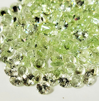 Unset small round grossular garnet melee in a light green hue are available. These gems are exceptionally brilliant and possess a dazzling, untreated appearance. The grossular garnets vary in color, ranging from very light green to a refreshing minty gree
