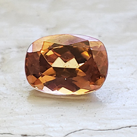 Brilliant antique cushion toffee color brown zircon.  This clean and well cut natural untreated zircon has flashes of golden cognac.