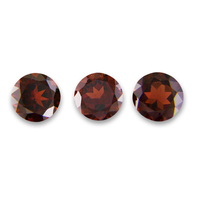 Round garnets in calibrated sizes ranging from approximately 6.5 mm garnets to 8 mm garnets. These fine quality round untreated red orange garnets have brown undertones and are well cut  and very lively. These round garnets are available in stock to 