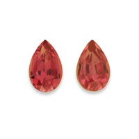 Pair of pear shape unheated orange sapphires from the Umba River Valley in Africa.  These sapphires have pink/reddish tone.