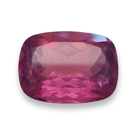 Large cushion pink tourmaline. This lively untreated cranberry pink tourmaline has purple peachy tones and is well cut.
