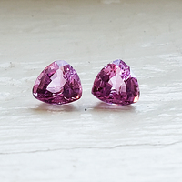 Pair of trillion fancy pink sapphires. This lovely pair of medium pink sapphires have a good triangle shape, clean and very lively.  This pair would be perfect as pink sapphire side stones.
