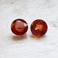 Bright pair of 5 mm round orange sapphires . This round pair of sapphires are lively with flashes red.