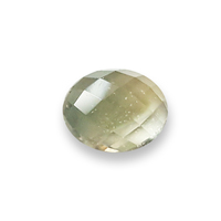 Rare 9 x 7 oval untreated yellow green sapphire rose cut.  This lively green yellow rose cut sapphire is well cut with a completely flat bottom and checkerboard style facets on it's cabochon dome top.  Nice transparent rose cut sapphire for many