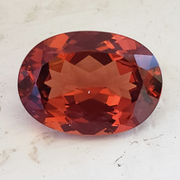 Large oval untreated fire orange Malaya garnet. This super lively oval Malaya orange garnet with flashes of red is clean and well cut.  Super brilliant!
