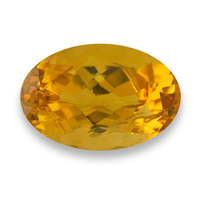 Oval precious topaz with a brilliant golden peach color.  This well cut and lively topaz has excellent clarity and is a very lively stone.