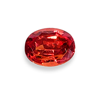 Oval orange sapphire from Umba River region of Tanzania, Africa.  This sapphire is unheated.  It is a deep orange color with copper flashes.