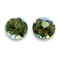 Matching pair of round green sapphires. This pair of 4.8mm green sapphires are clean and lively. Nice round  green sapphire pair as side stones for a ring or beautiful pair of green sapphire earrings!