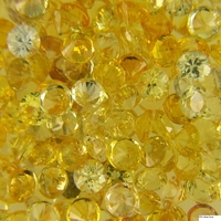 Extensive collection of calibrated diamond-cut round yellow sapphire melee in a wide range of shades. From very pale, almost colorless yellow sapphires to light diamond-like yellow sapphires, to medium lemon yellow sapphires, and even intense golden yello