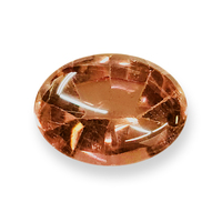 Natural untreated peach sapphire.  This oval buff-top salmon orange sapphire is from the Umba River region of Africa and is very unique and well-cut with its cabochon top and faceted bottom.