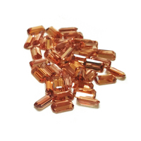 Rare, untreated Malaya garnet baguette melee. These stunning step-cut orange garnet emerald-cut baguettes exhibit a lively and vibrant orange color. They can be a captivating choice as a center stone or can be matched perfectly in suites for various jewel