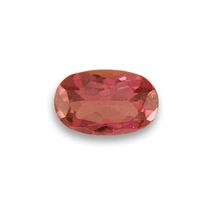 Oval African padparadscha color orange sapphire.  It is unheated /untreated.  This sapphire is predominately pink and peach in color with orange undertones.